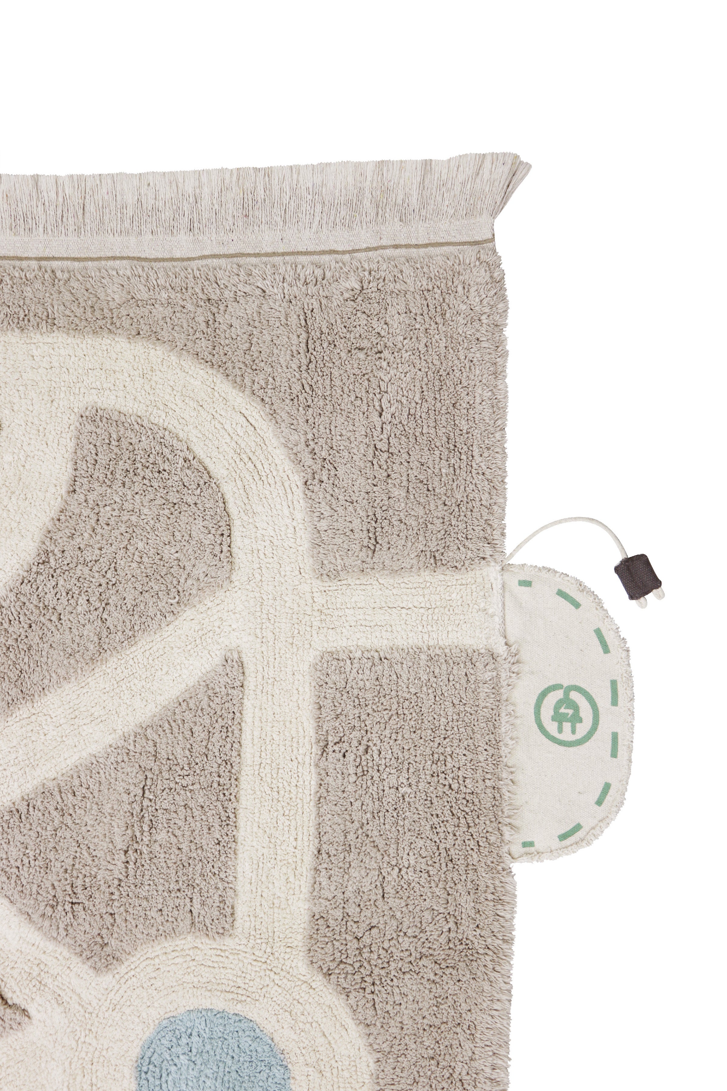 Grey, cream, blue, and green rug with city plan pattern and added city toys