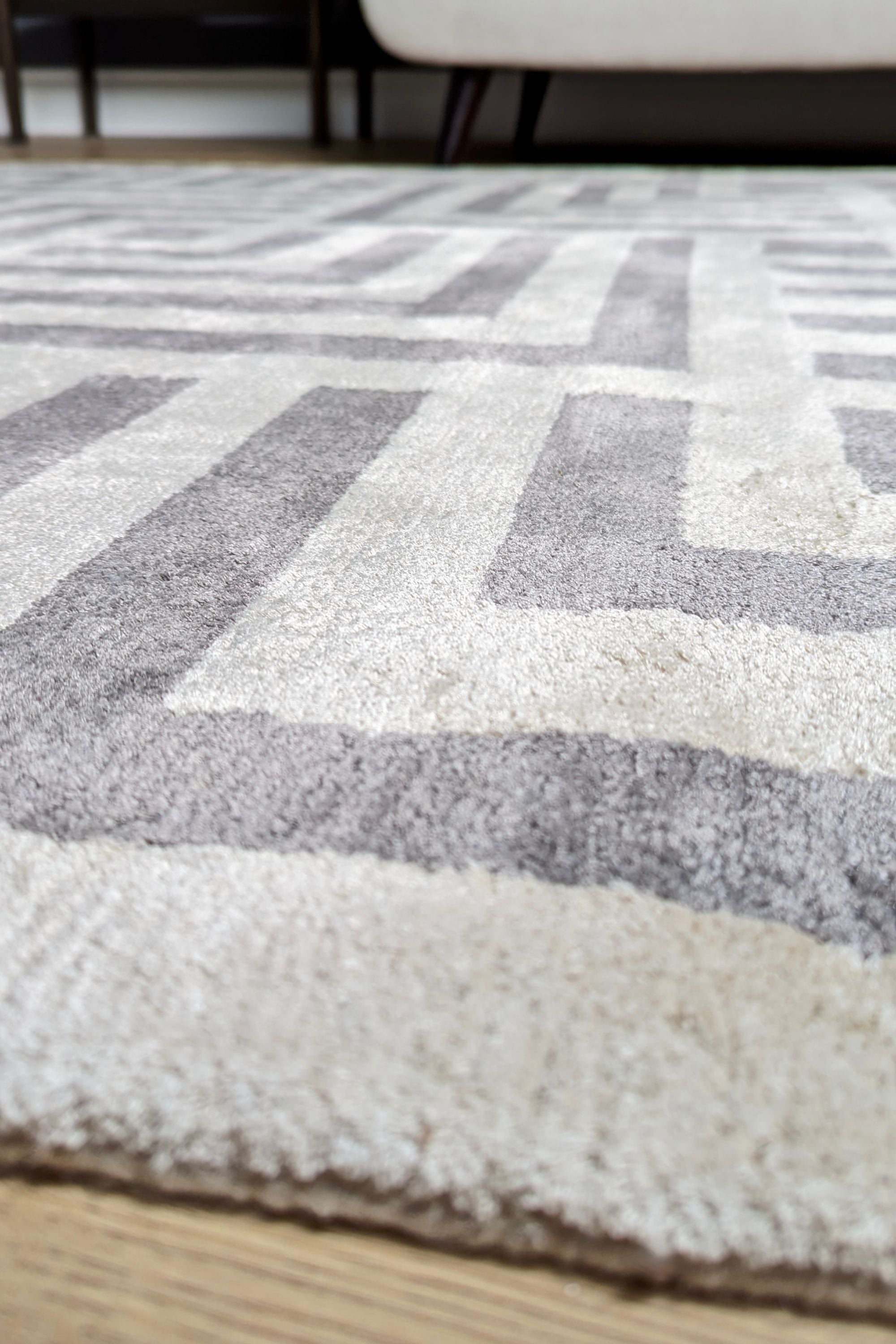 geometric area rug in grey and white