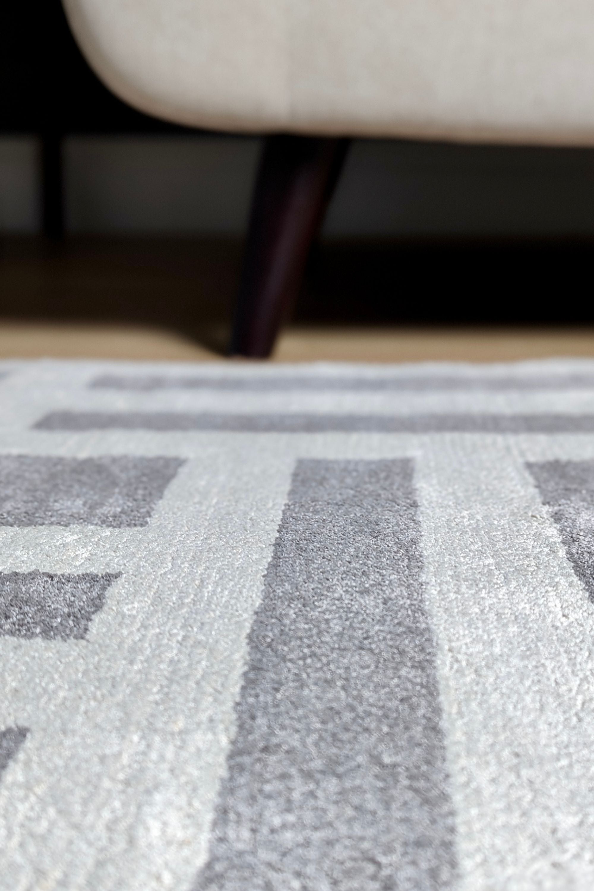 geometric area rug in grey and white