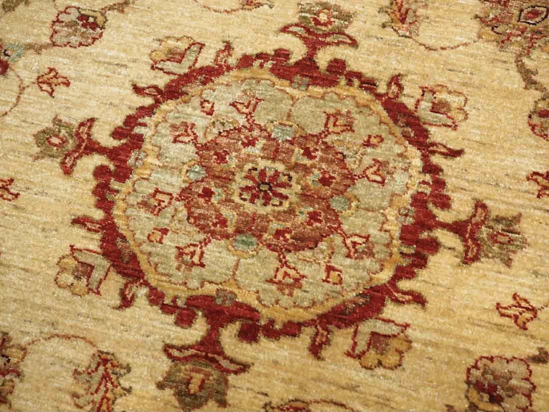 Authentic oriental rug with delicate floral pattern in beige