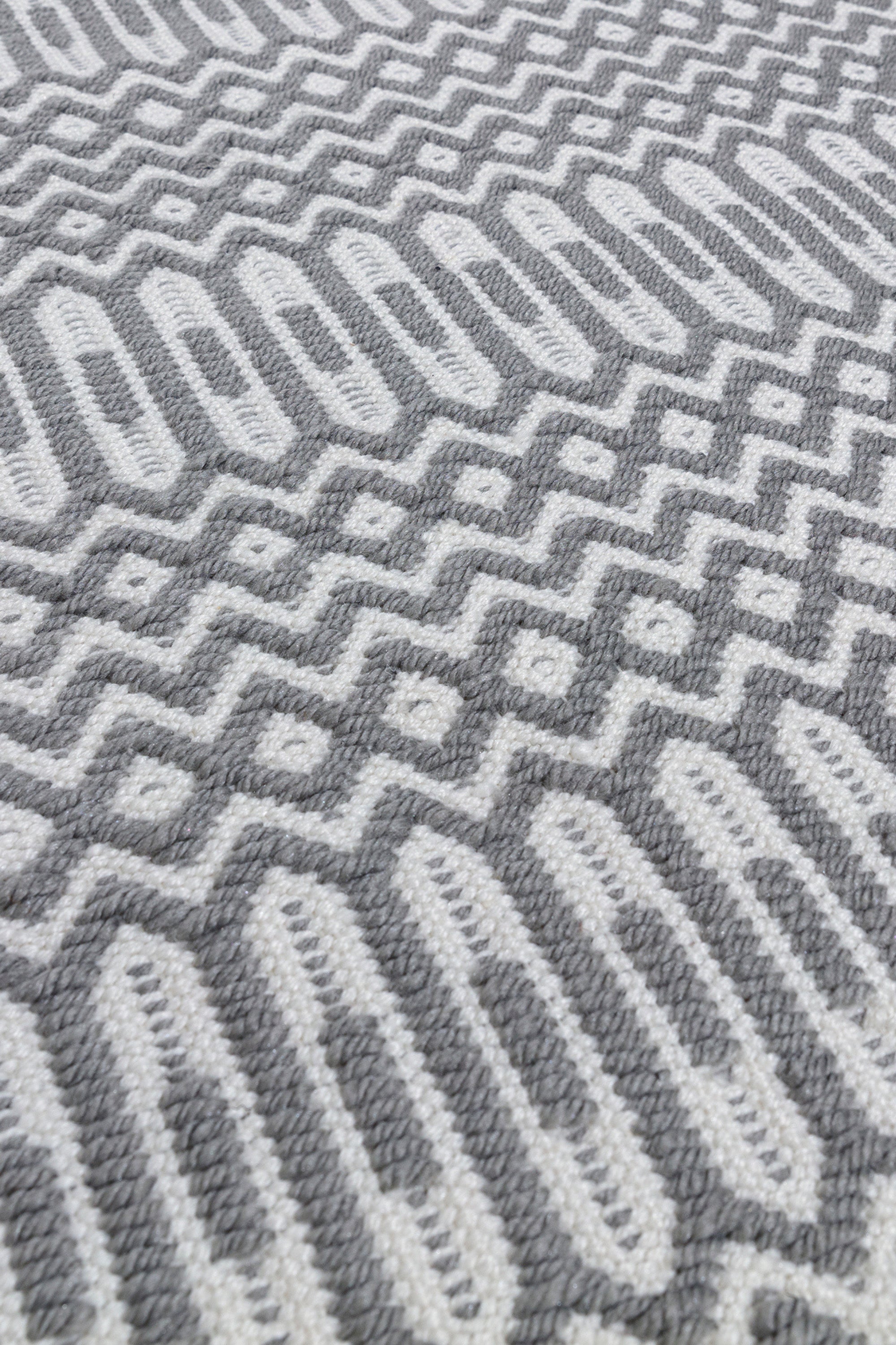 grey indoor/outdoor rug with geometric design