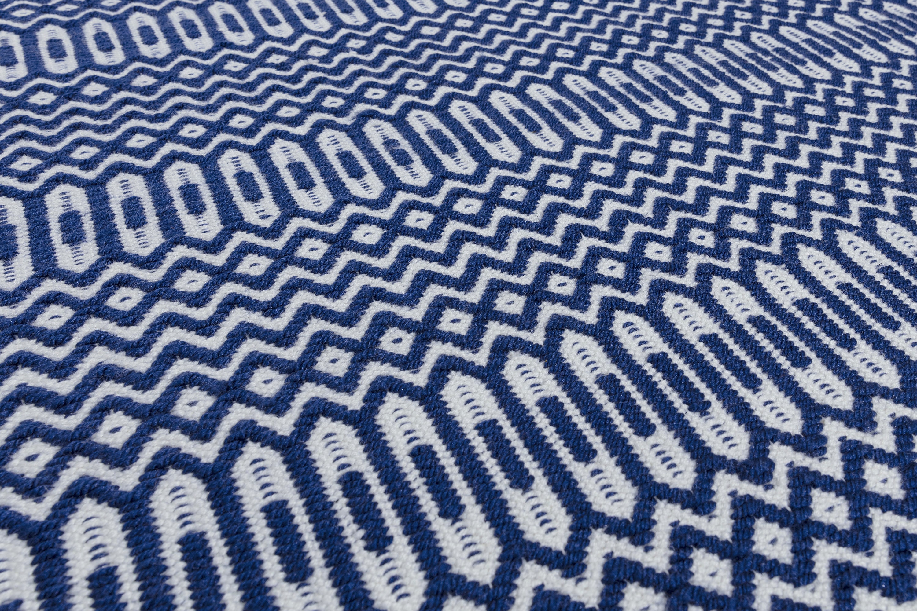 blue indoor/outdoor runner with geometric design