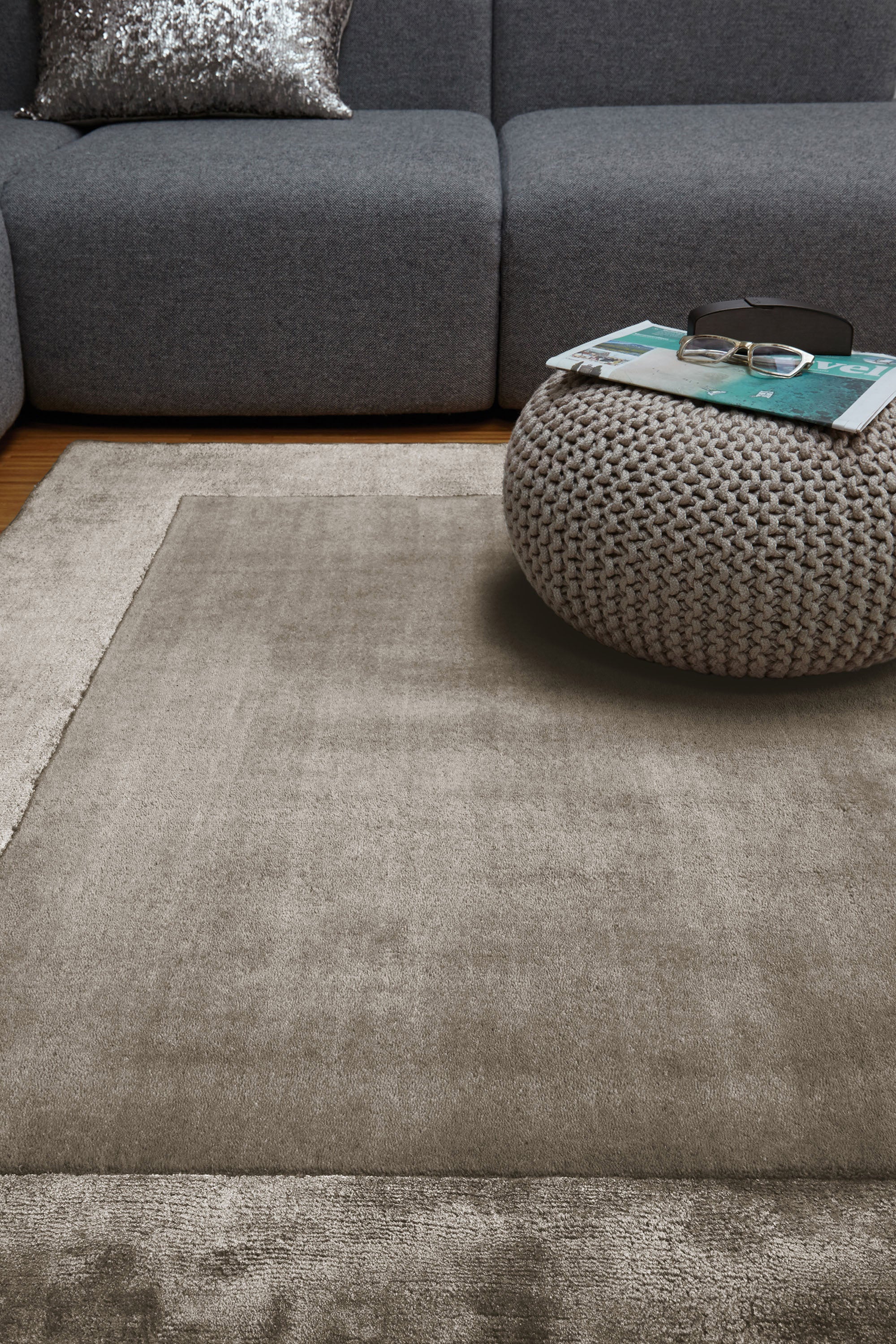 taupe brown wool and viscose rug with a border design