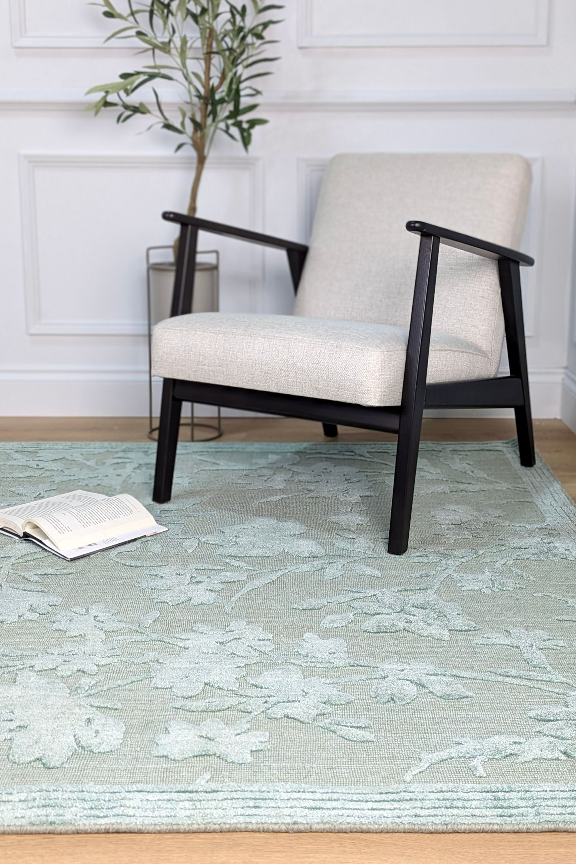 Bamboo silk, cotton and wool rug in blue with floral design.