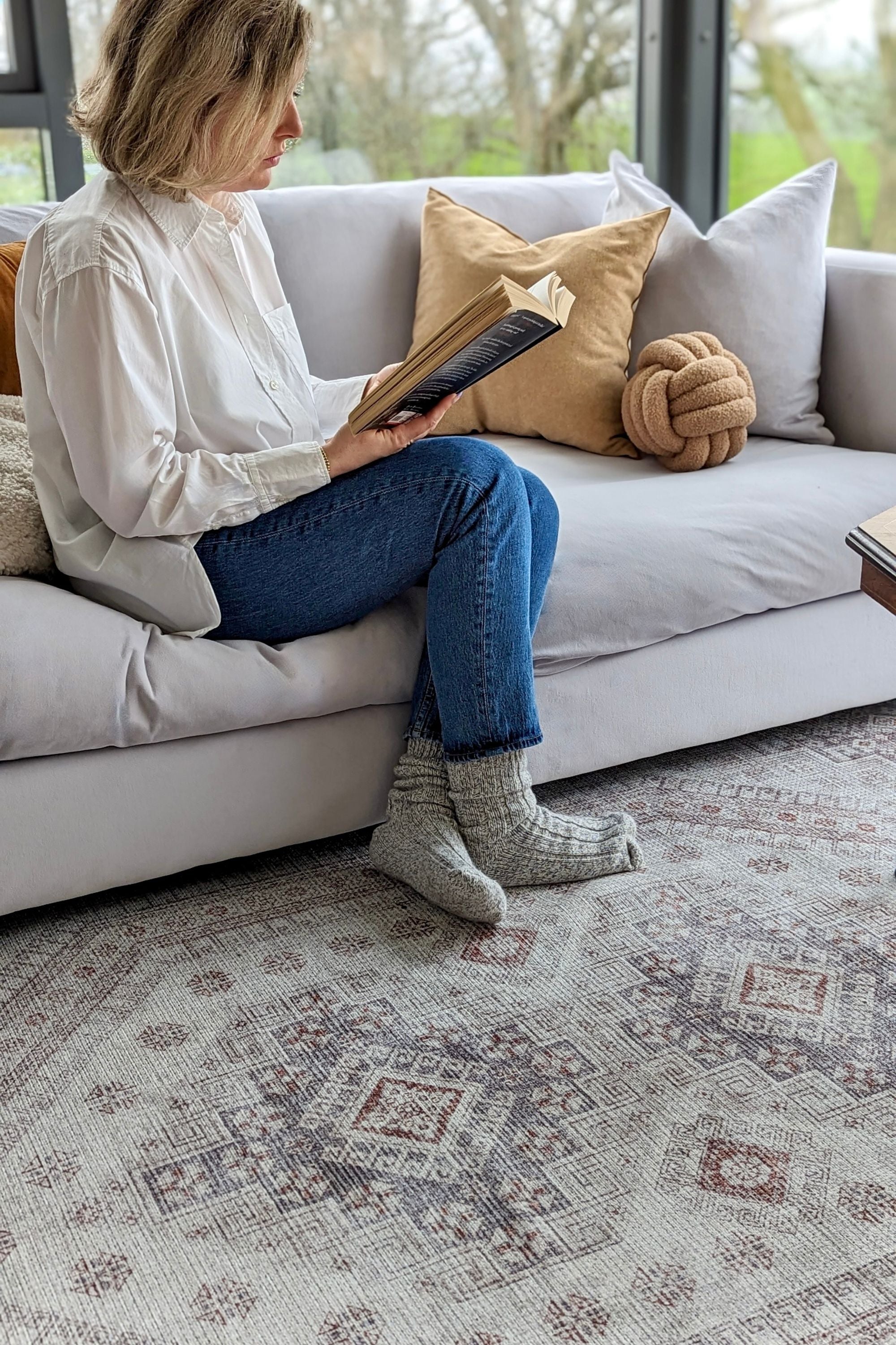 Persian inspired area rug in cream, grey and rust tones