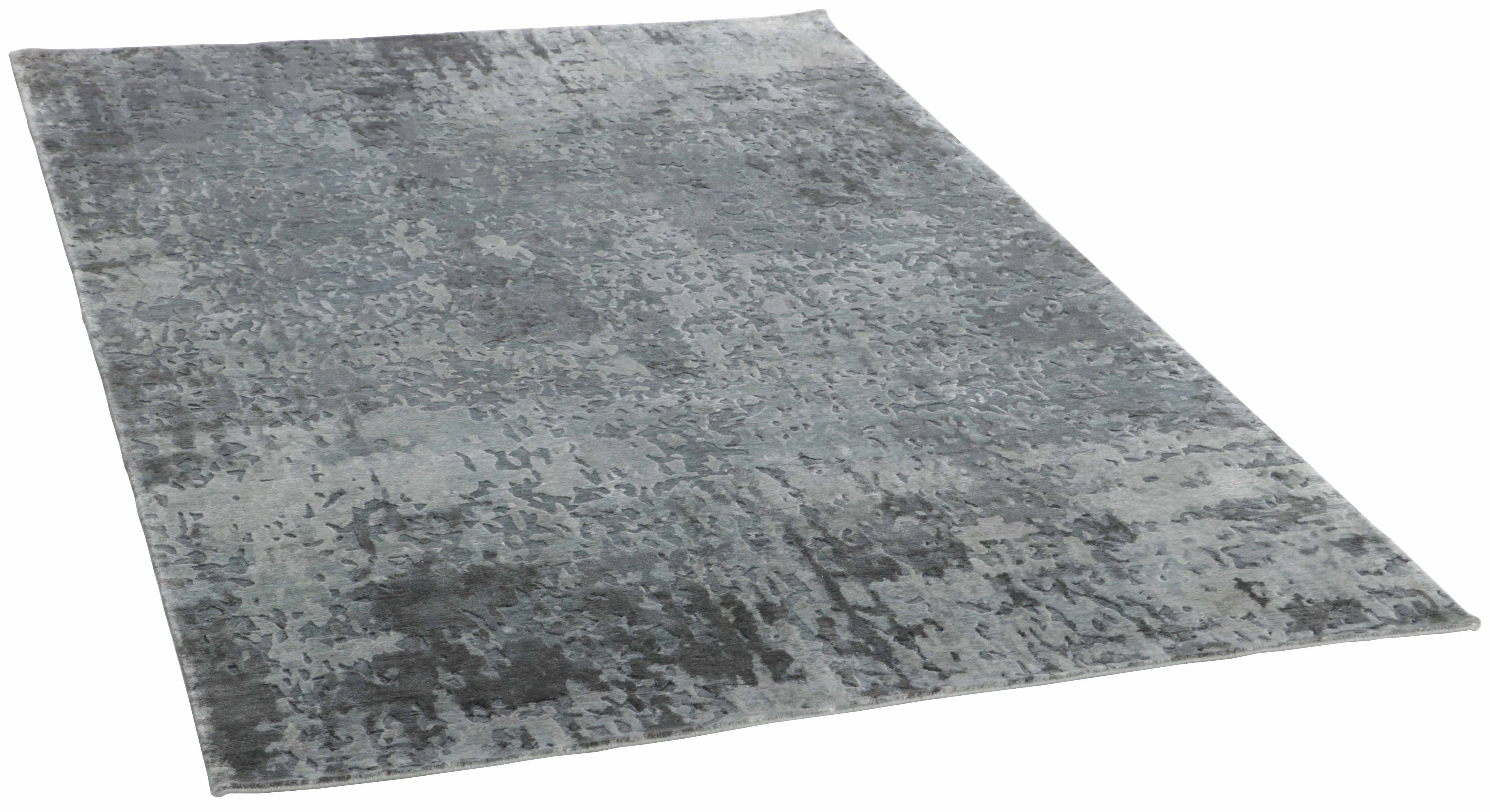 Large area rug with  abstract design in grey and beige