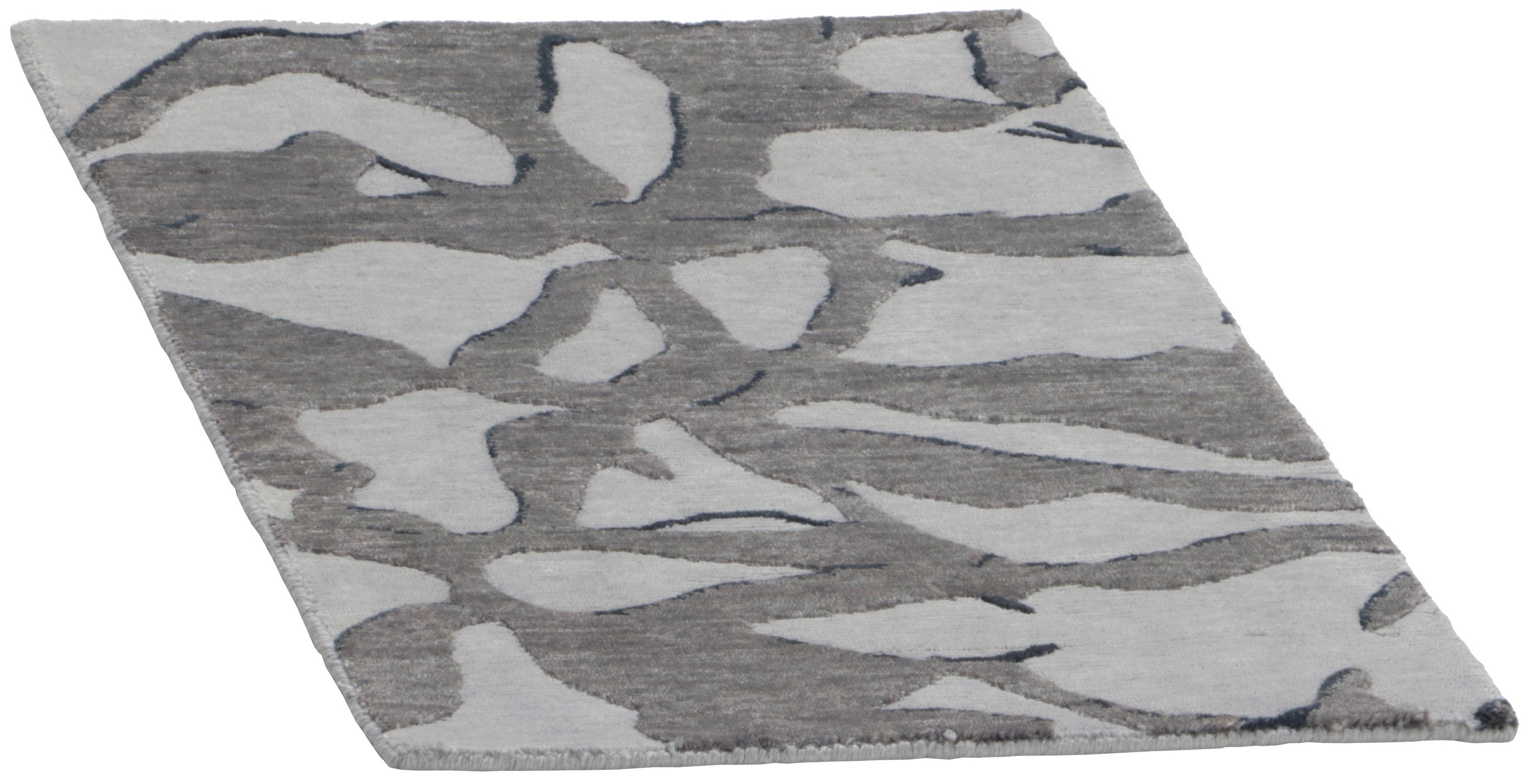 Area rug with abstract design in grey and beige