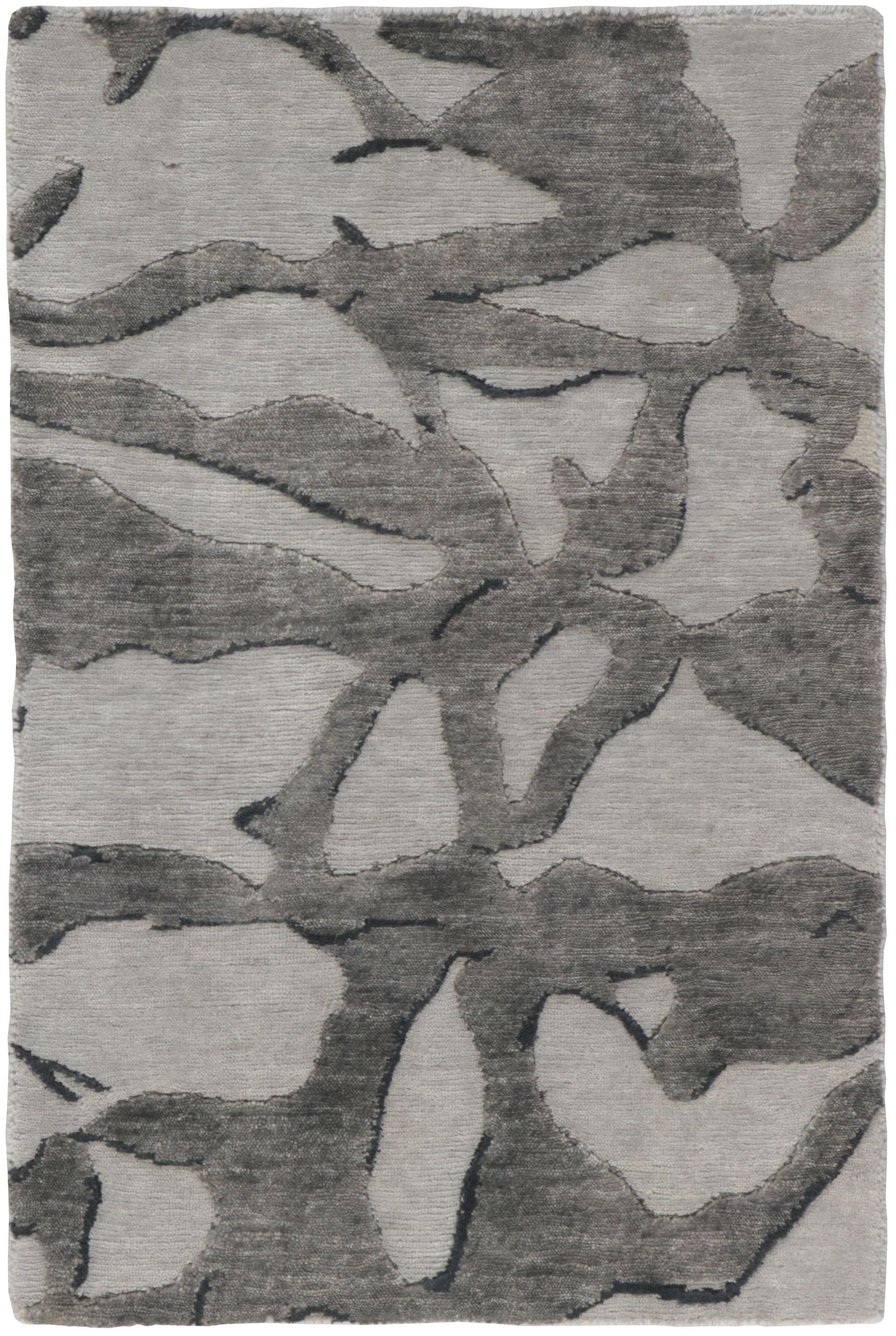 Area rug with abstract design in grey and beige