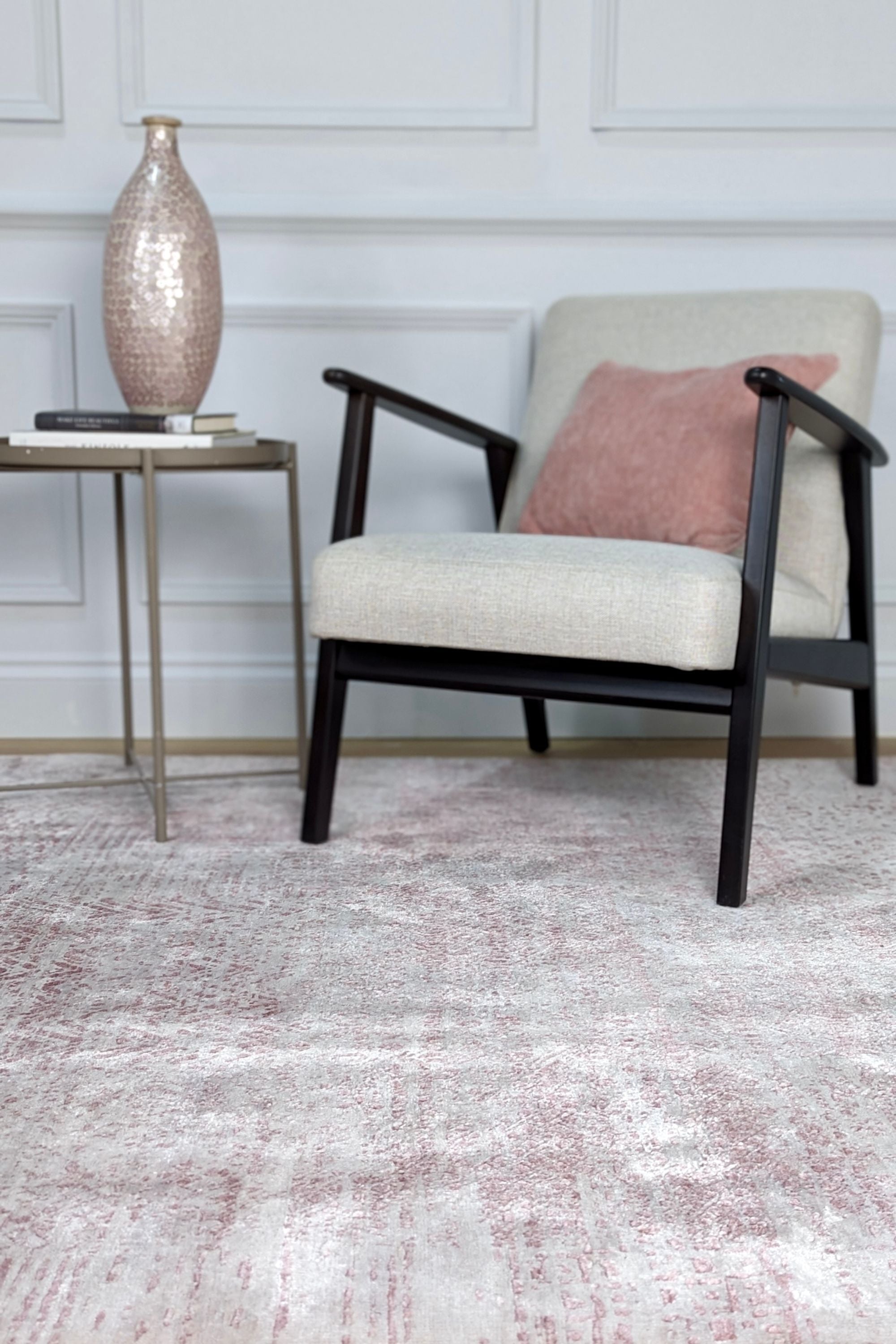 Pink and beige abstract area rug