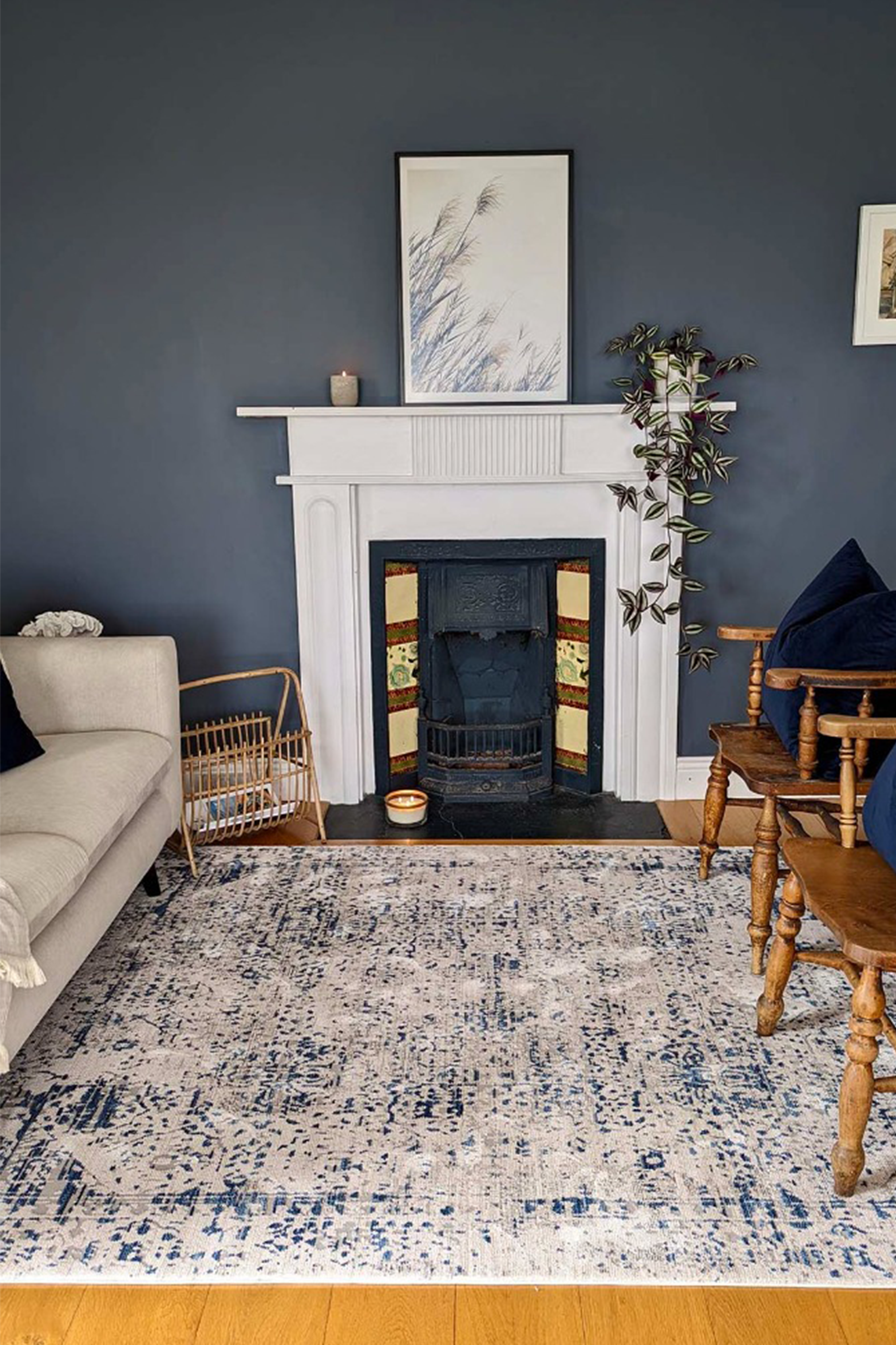 grey Persian style area rug with navy detail