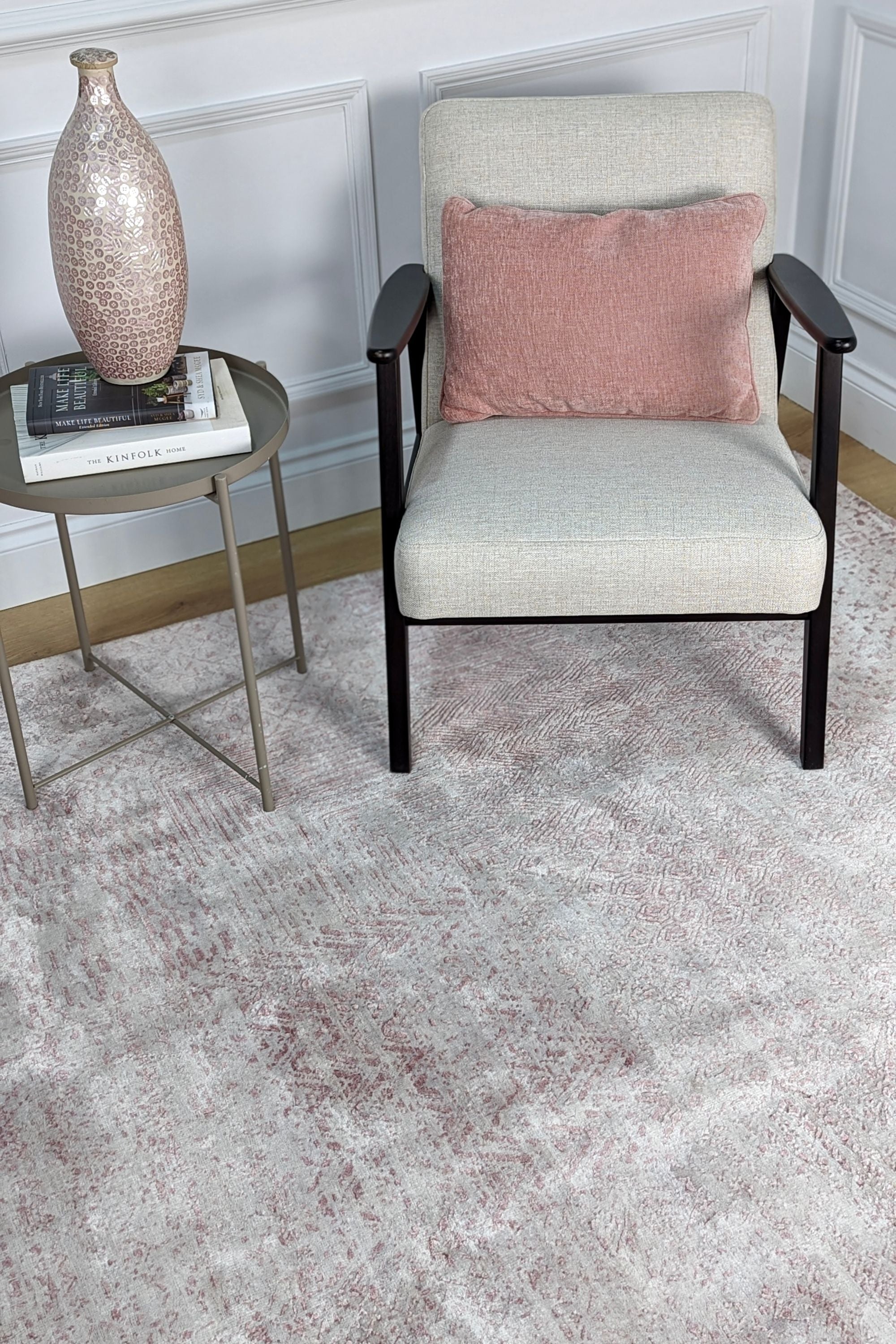 Pink and beige abstract area rug