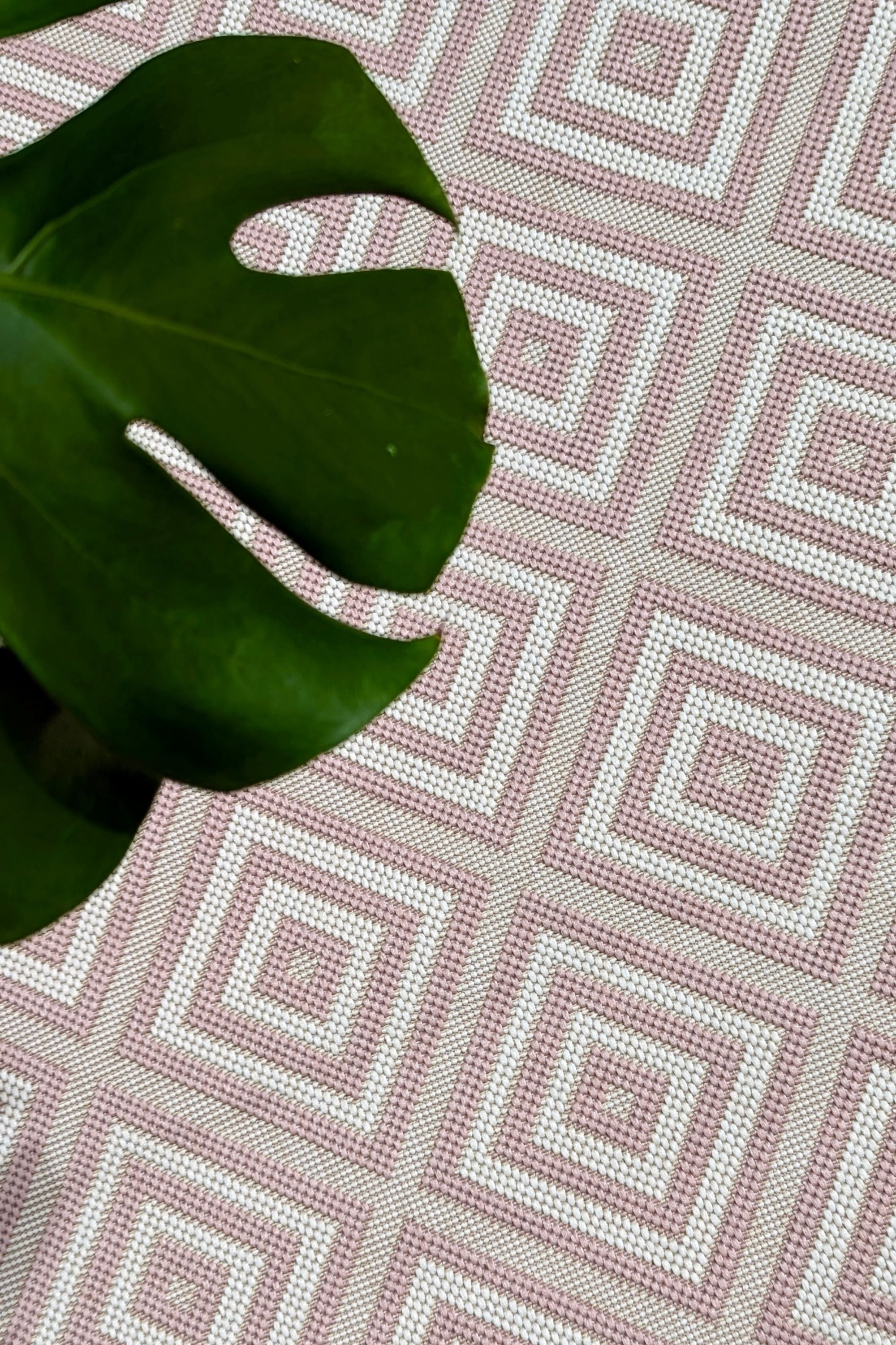 pink and white geometric rug for indoors and outdoors