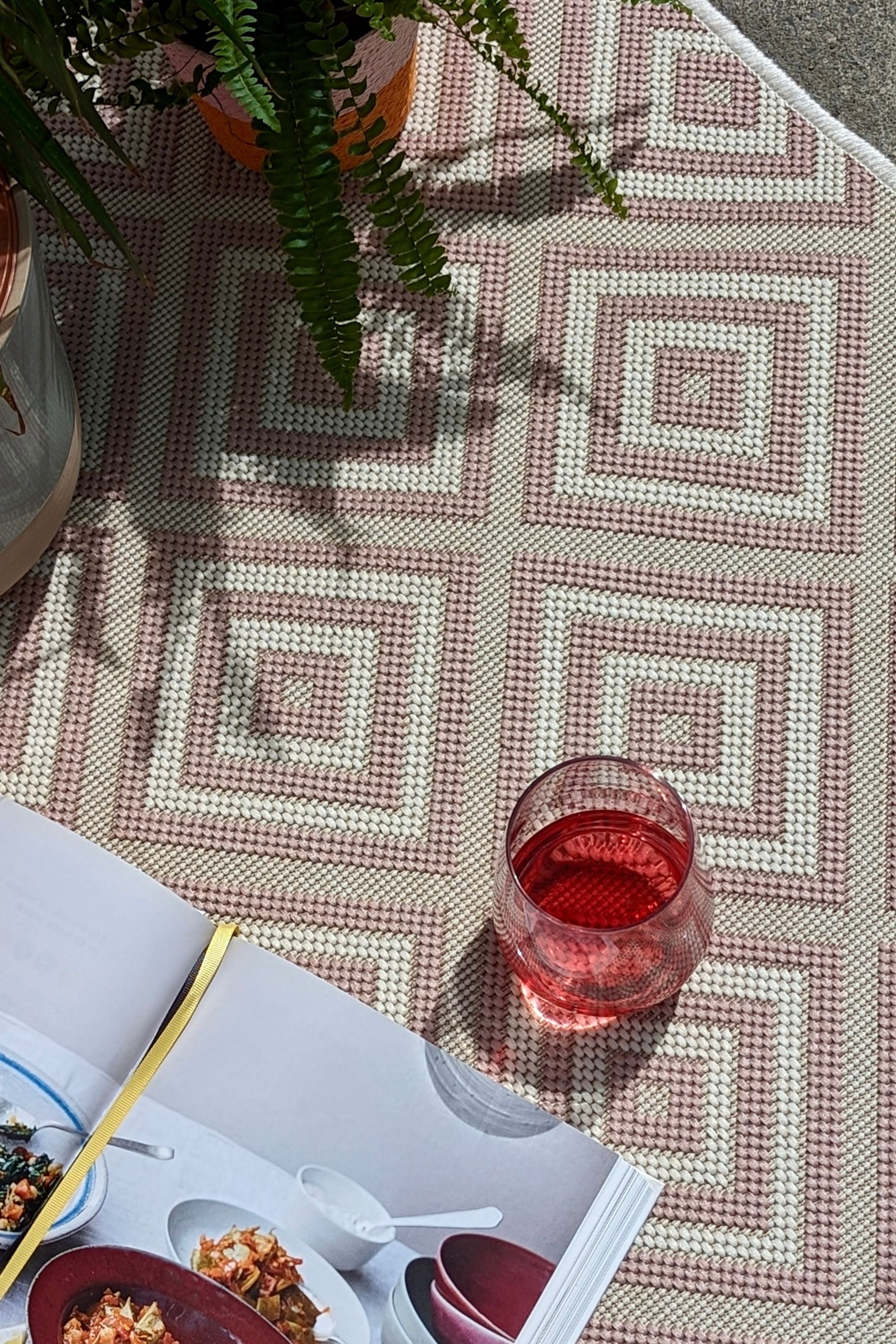 pink and white geometric rug for indoors and outdoors