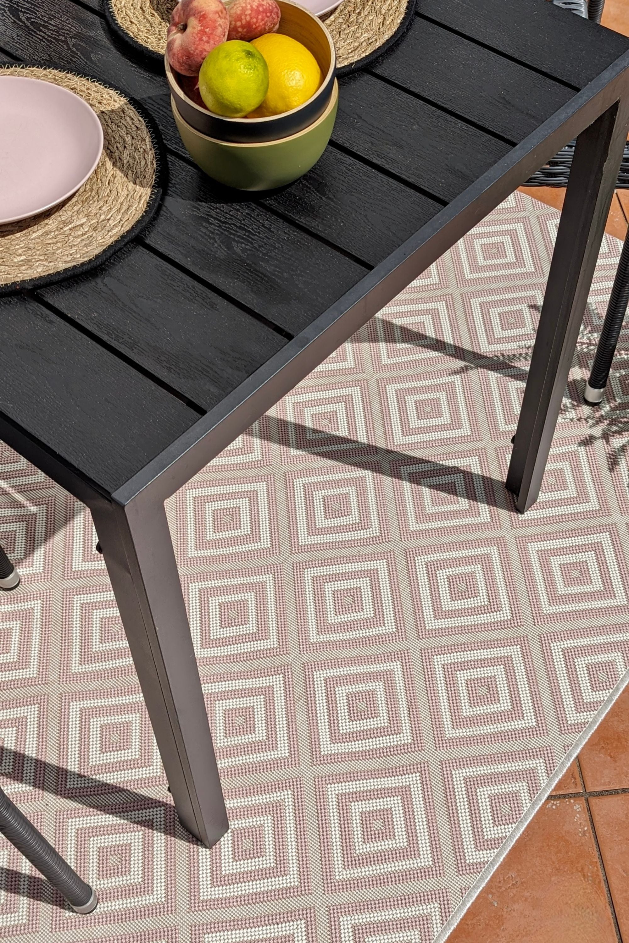 pink and white geometric rug for indoors and outdoors