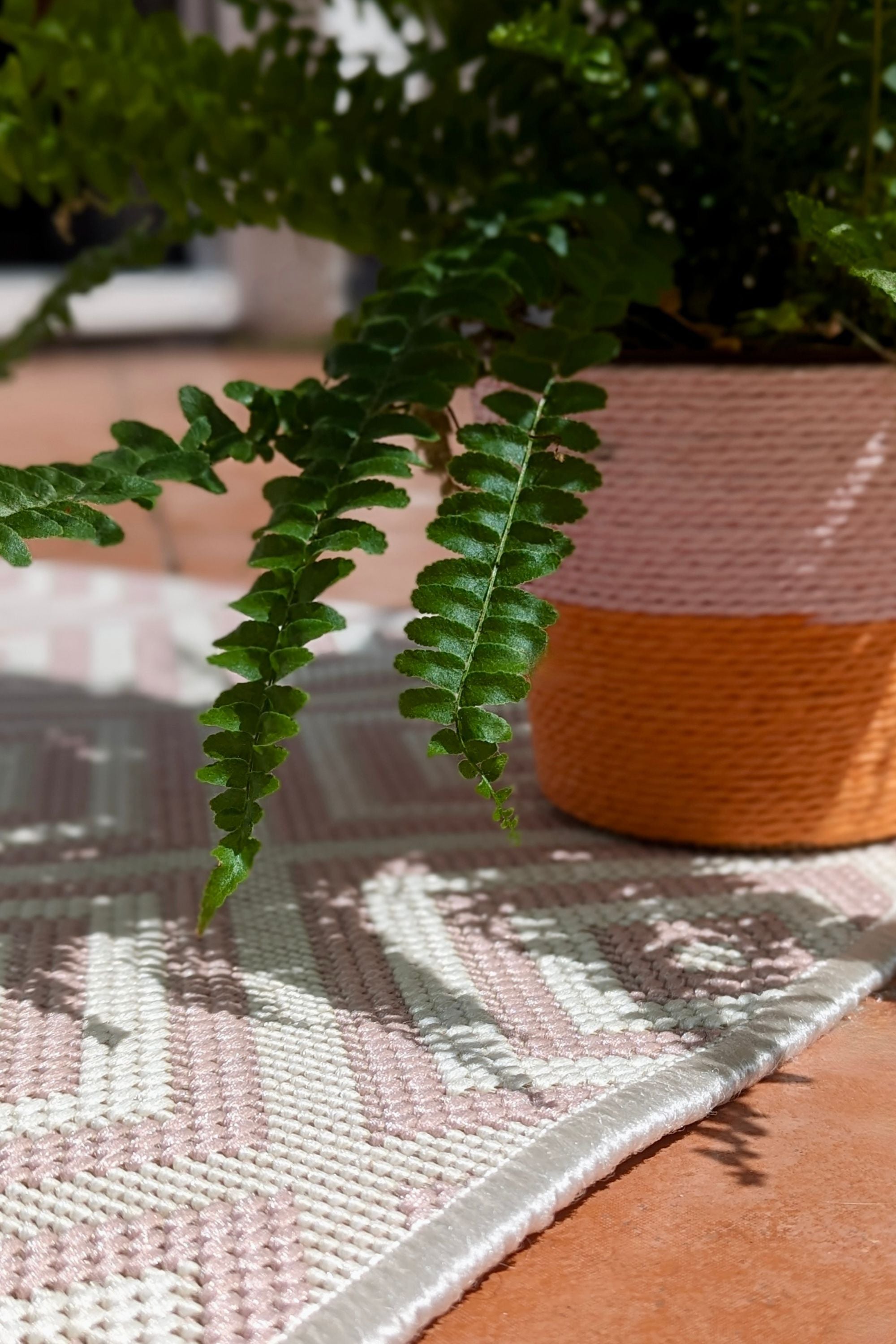 pink and white geometric rug for indoors and outdoors