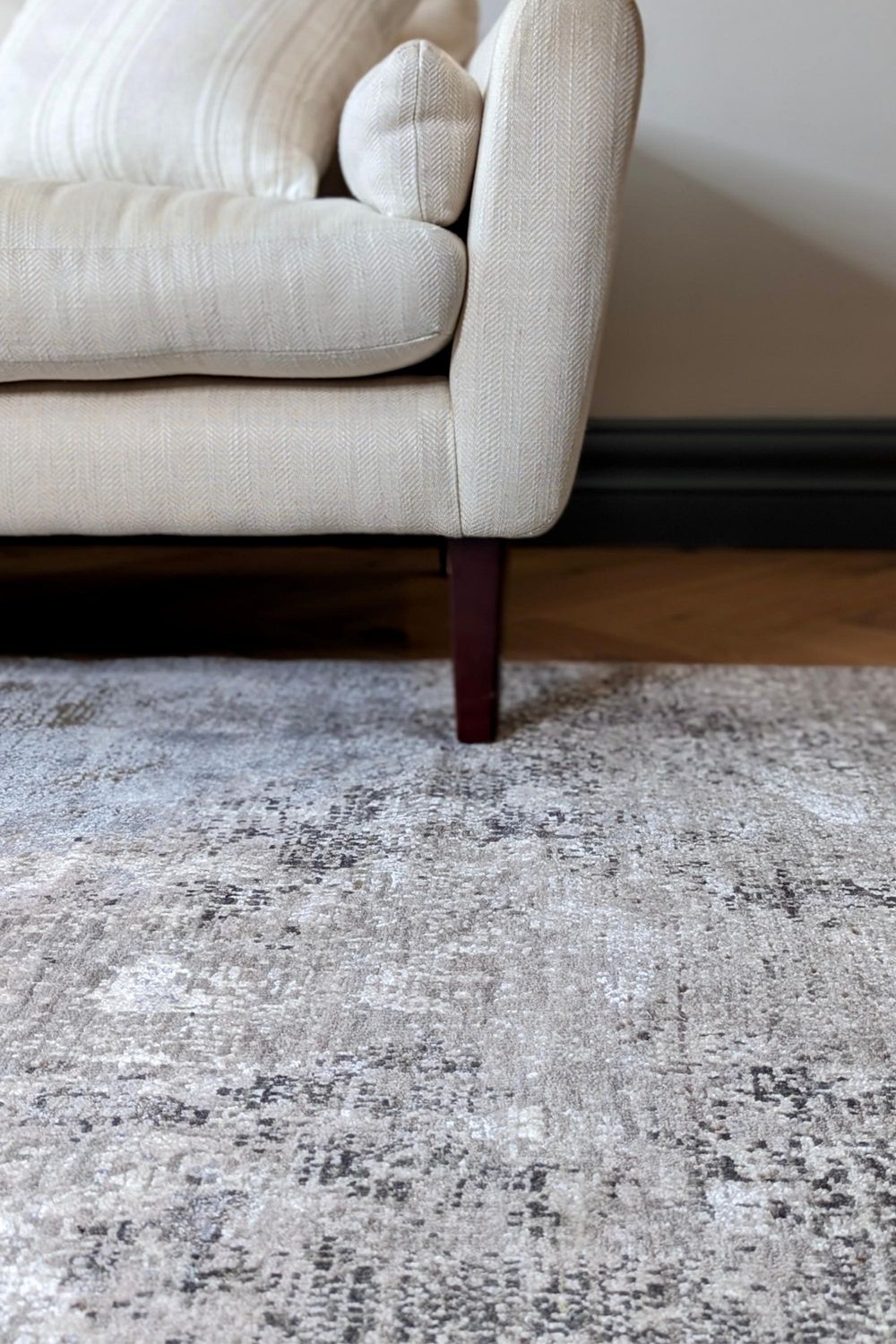 Large area rug with abstract design in grey and beige