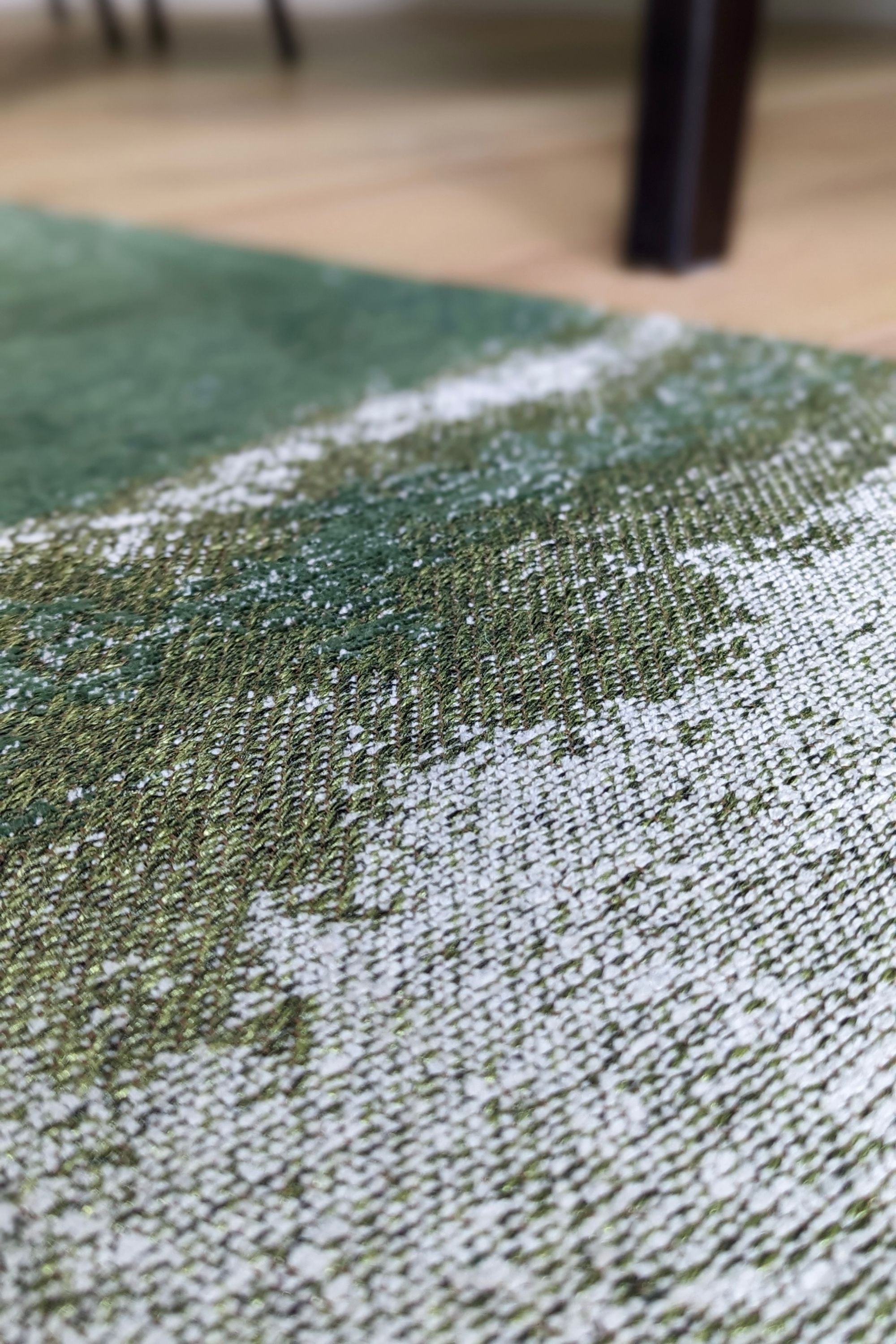 Modern rug with green abstract shoreline pattern