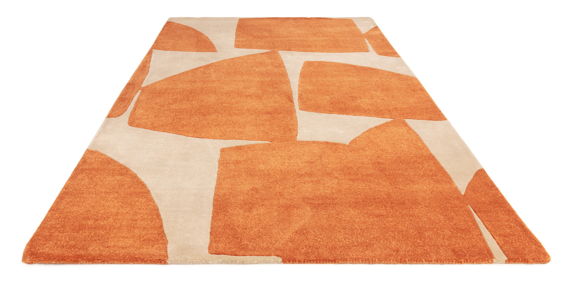 Orange and cream rug with abstract pattern