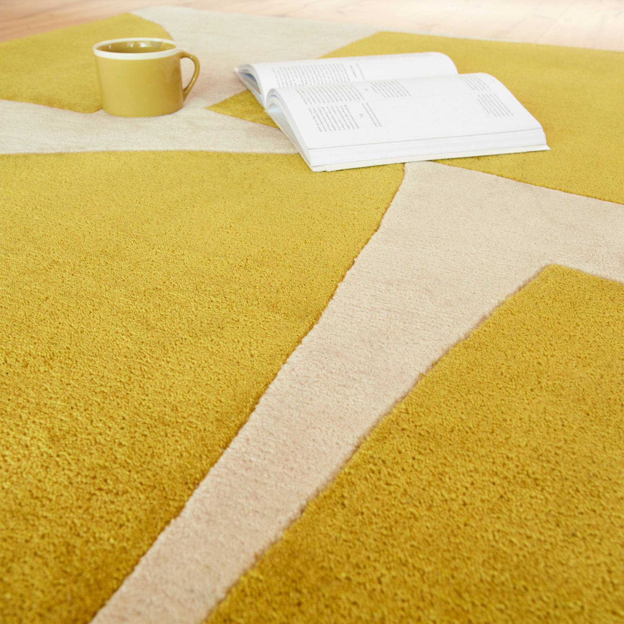 Yellow and cream rug with abstract pattern