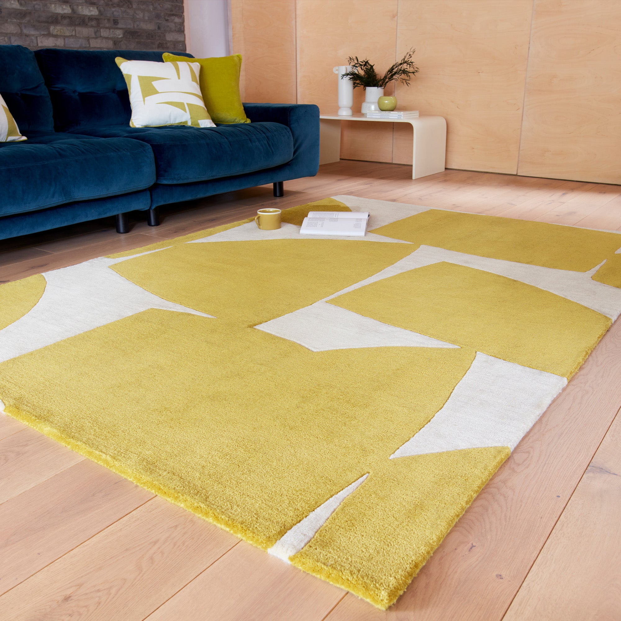 Yellow and cream rug with abstract pattern