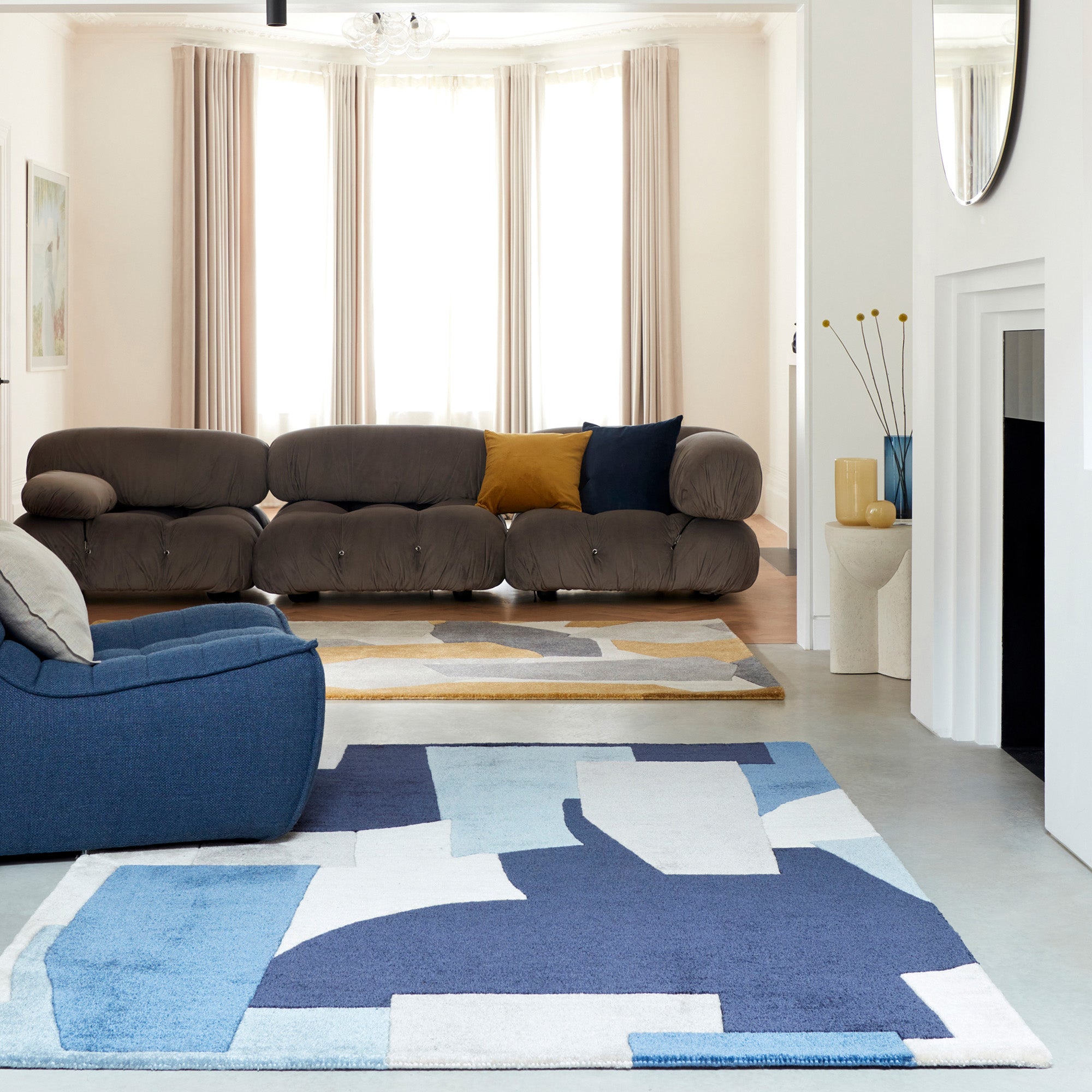 Multicolour rug with abstract pattern in blue, grey, and cream tones