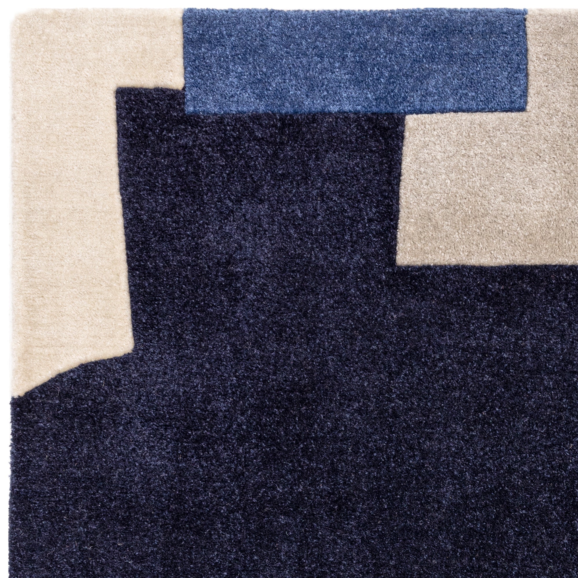 Multicolour rug with abstract pattern in blue, grey, and cream tones