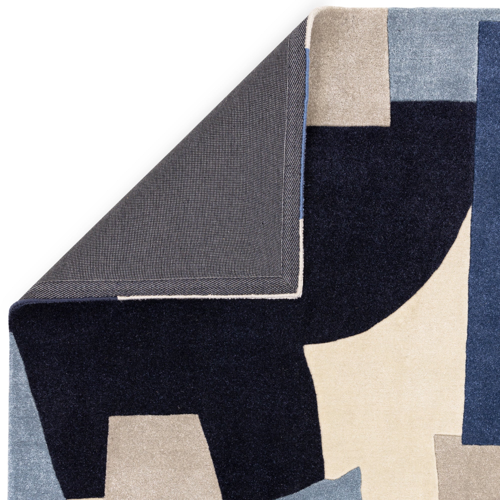 Multicolour rug with abstract pattern in blue, grey, and cream tones