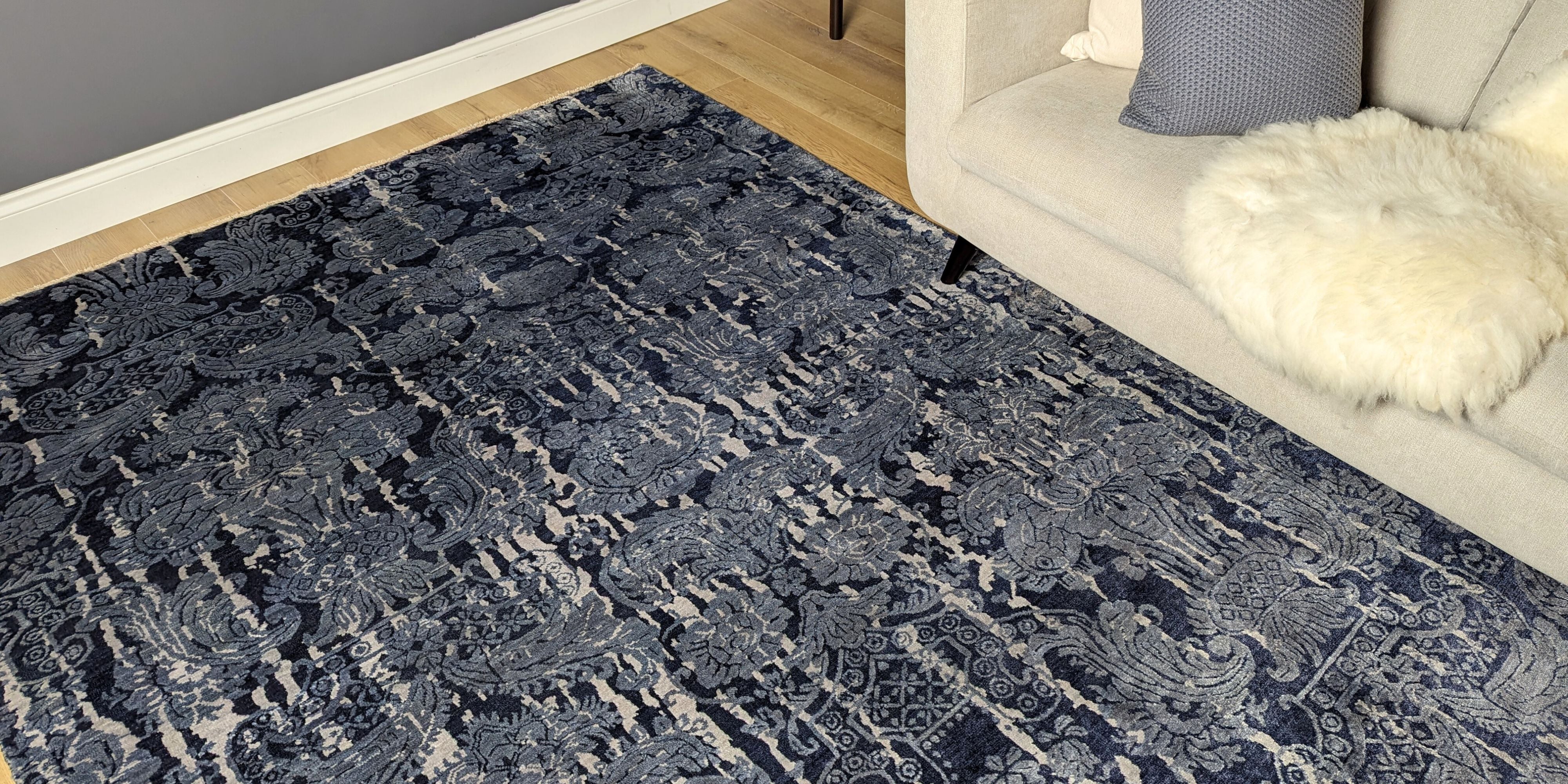 Authentic oriental rug with a damask pattern in blue and grey