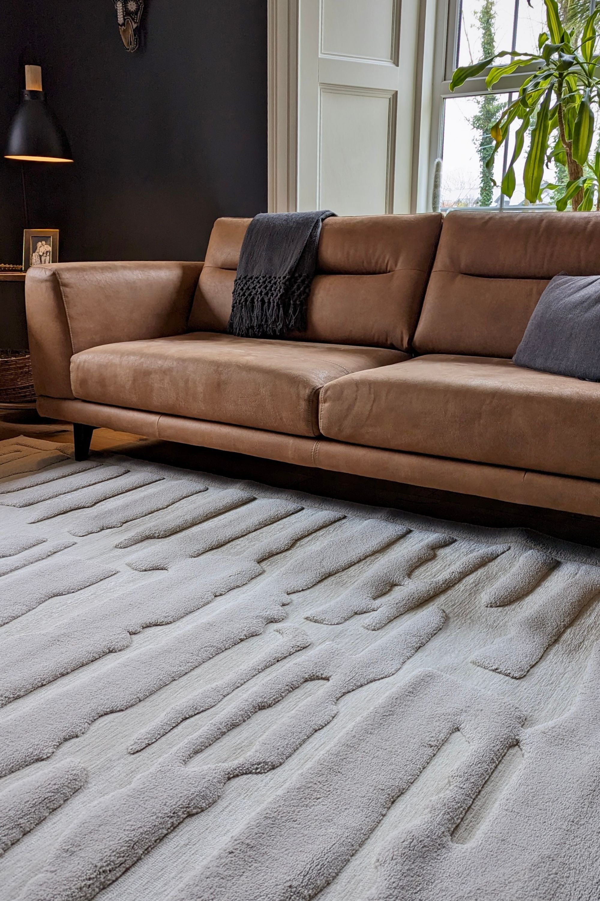 Cream rug with high-low pile and minimal geometric pattern 