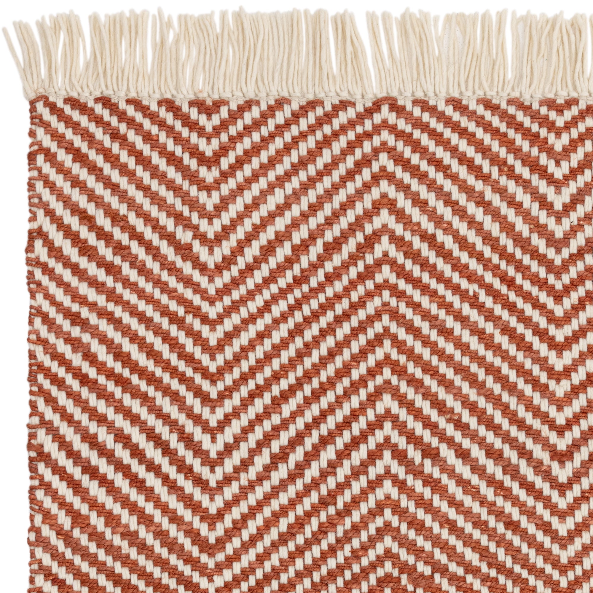Textured woven rug with red and cream chevron pattern
