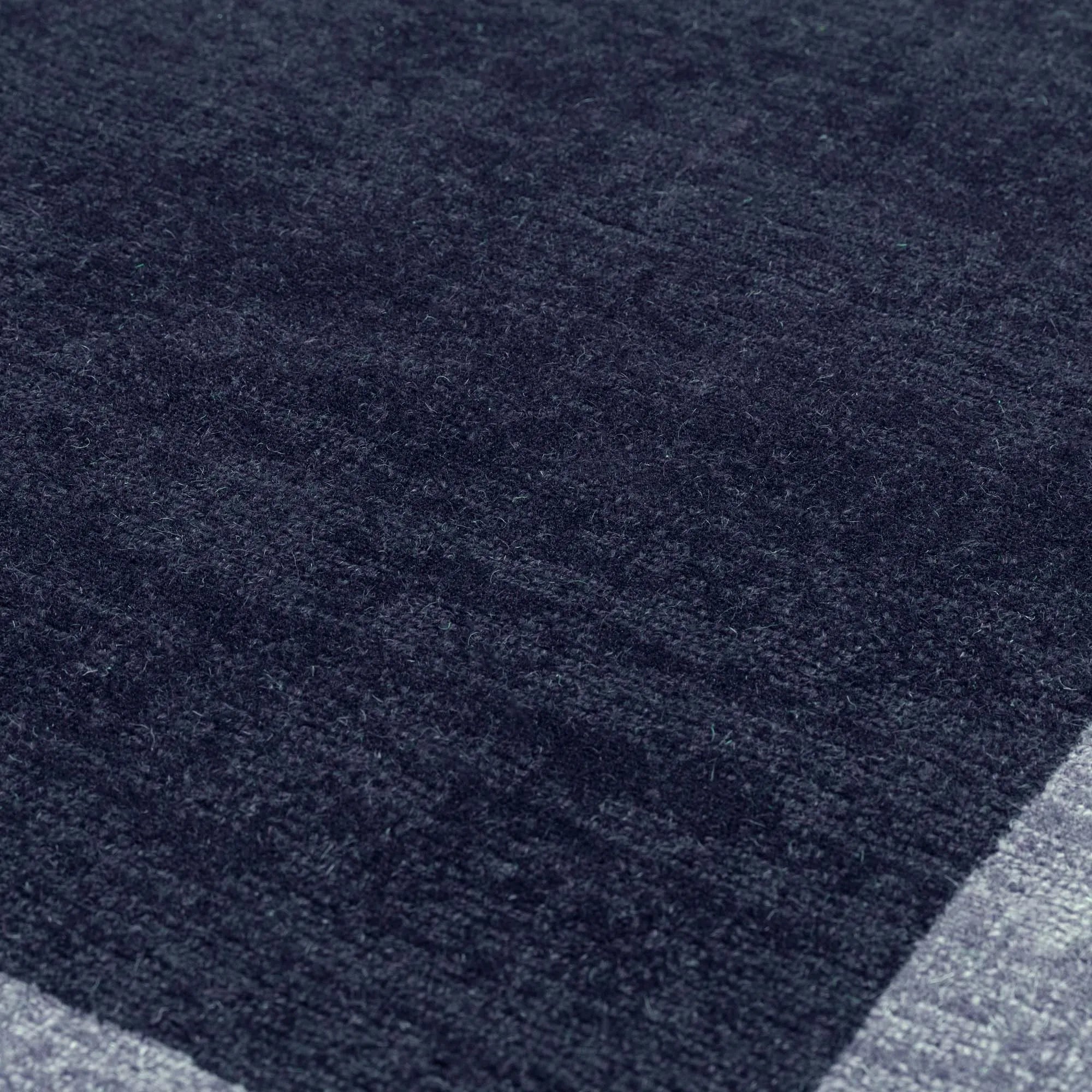 Modern navy border style rug