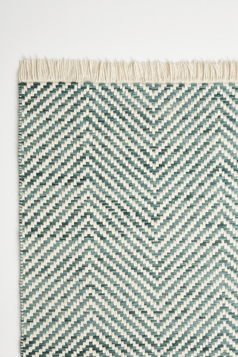 striped blue and white brink and campman rug
