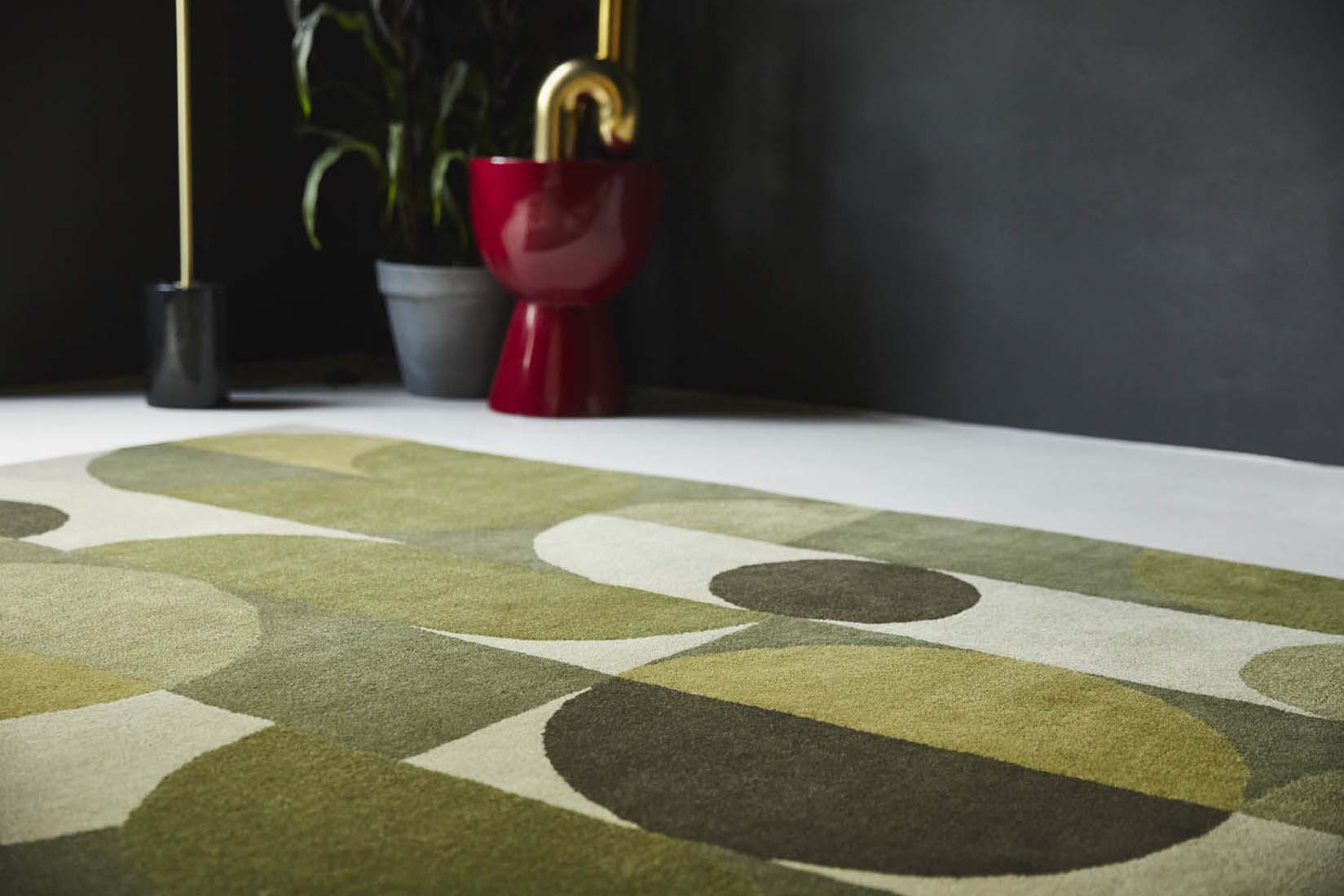 green wool area rug with retro design 
