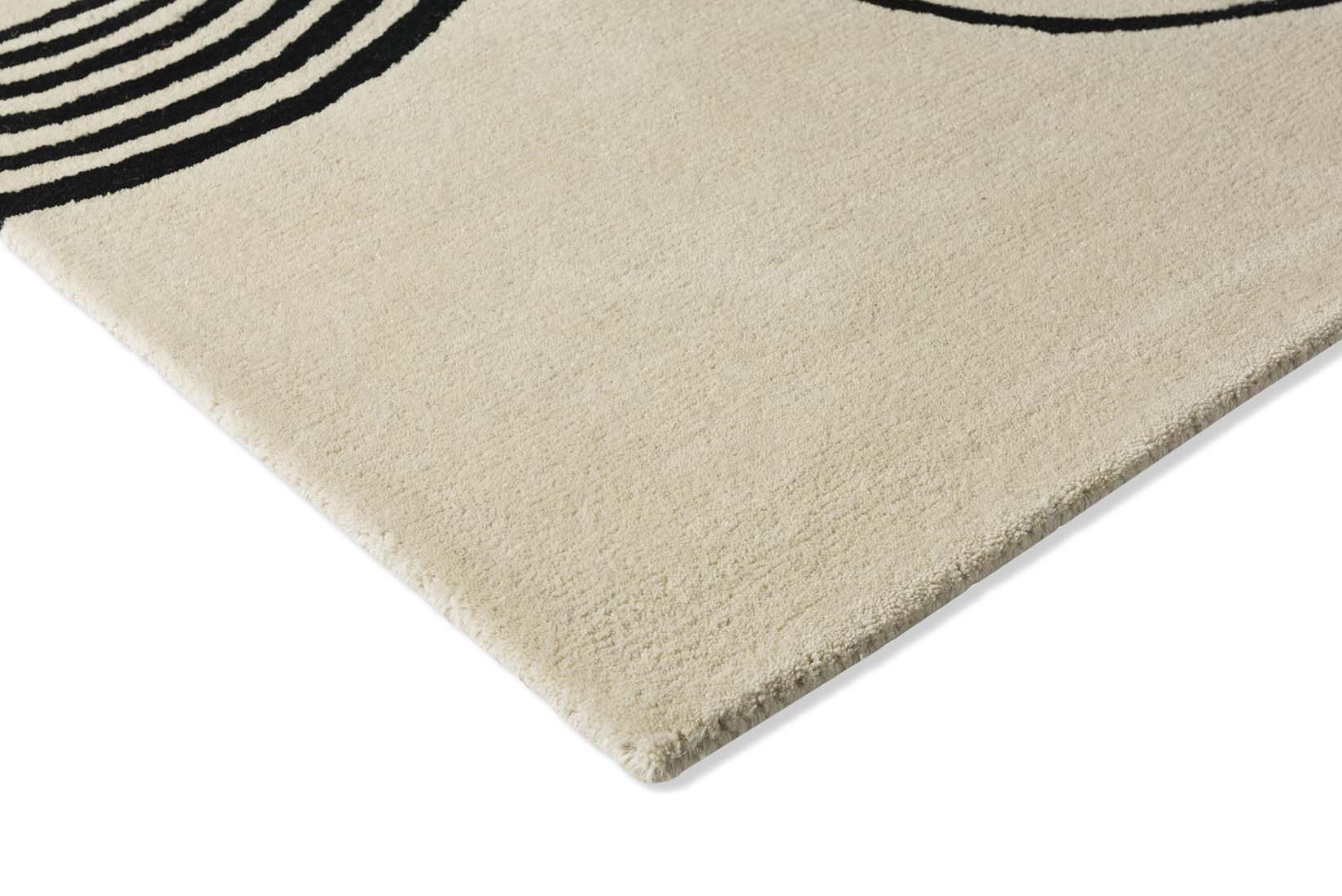 beige rug with black brush strokes 
