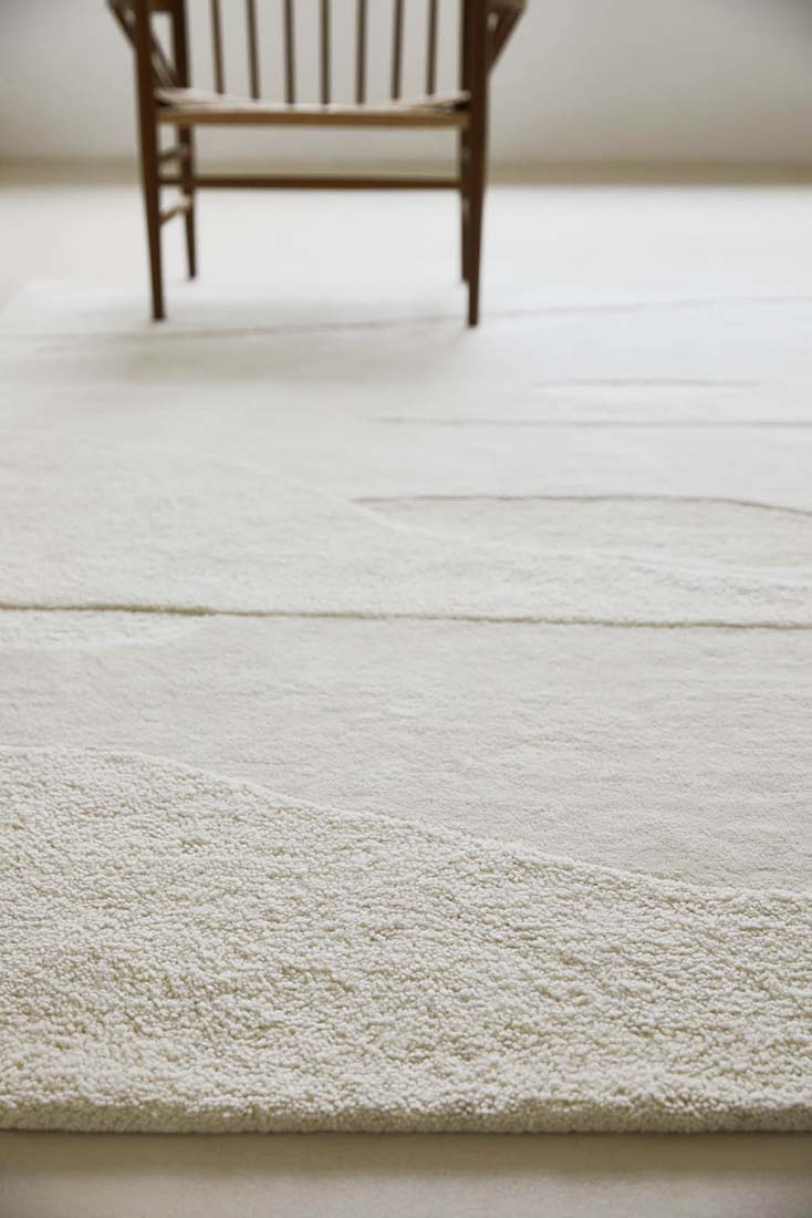 cream wool area rug with subtle texture detail
