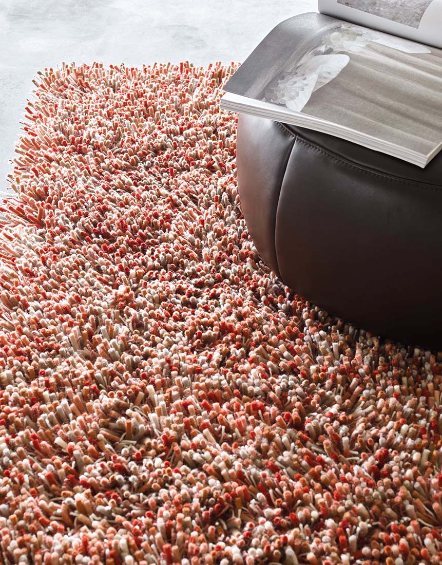 red and cream shagpile area rug 
