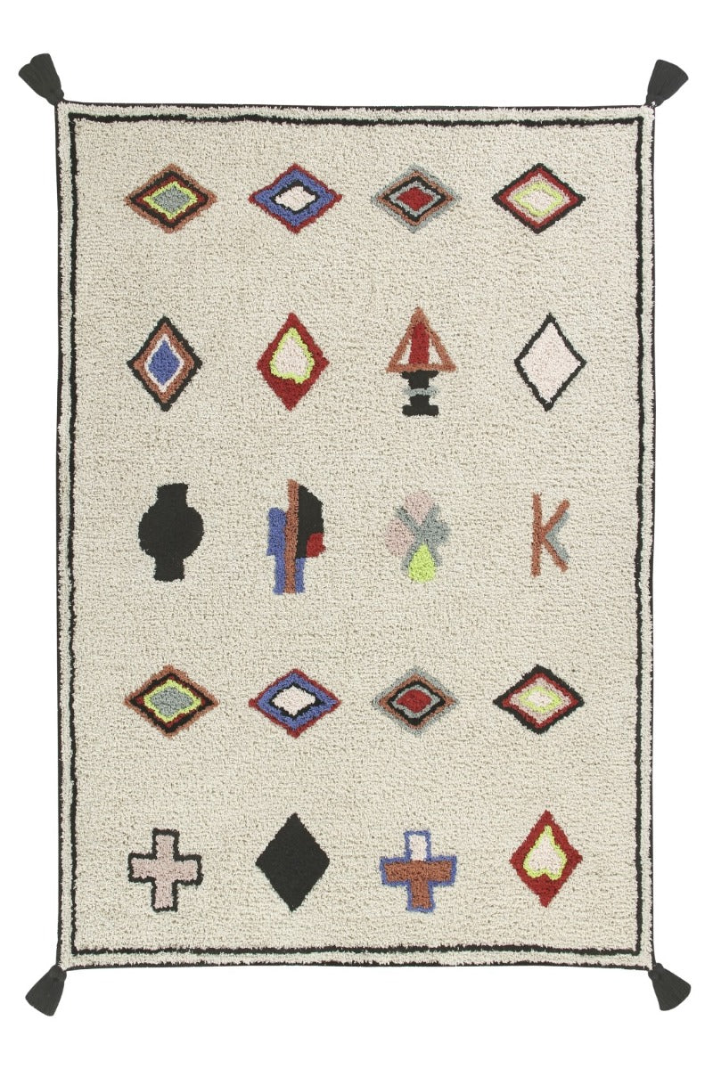Rectangular ivory cotton rug decorated with Moroccan tribal shapes and black border. Large black tassel on each corner.