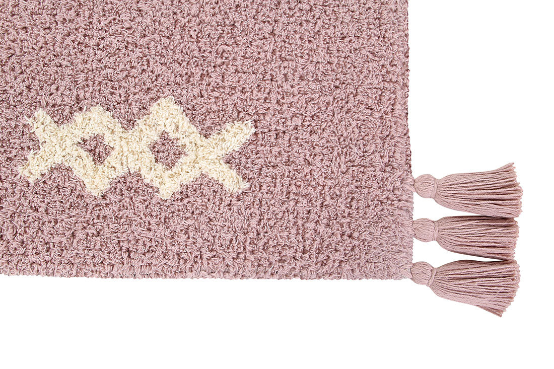 Pink lorena canals cotton rug decorated with shapes and tassels