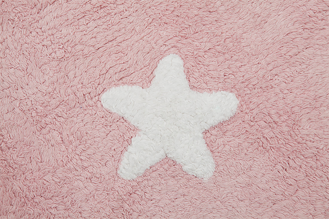 Rectangular pink cotton rug decorated with white stars