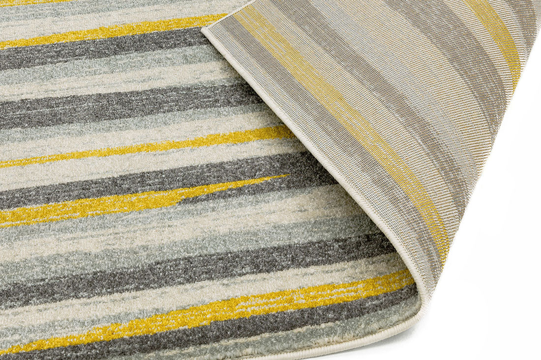 Polypropylene rug with abstract stripe pattern in grey and yellow