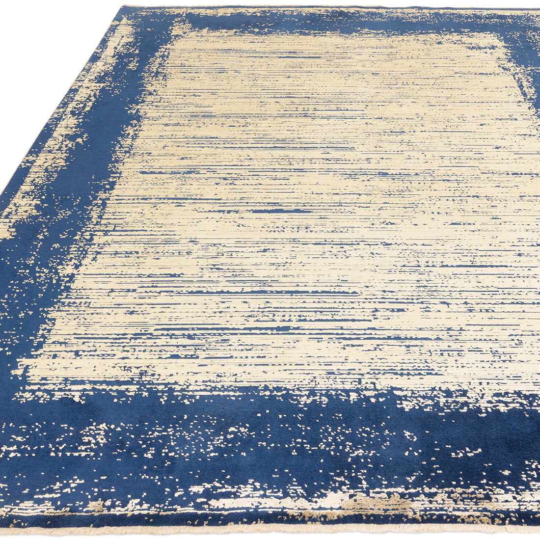 Acrylic shrink and viscose area rug in shades of twilight navy and gold 
