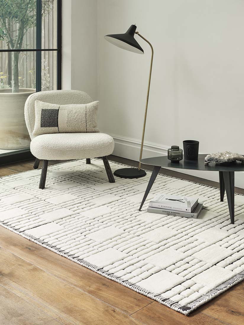 cream and black wool rug with subtle geometric pattern
