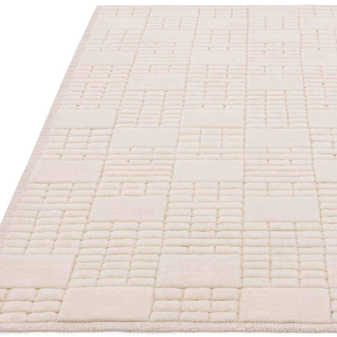 cream wool rug with subtle geometric pattern