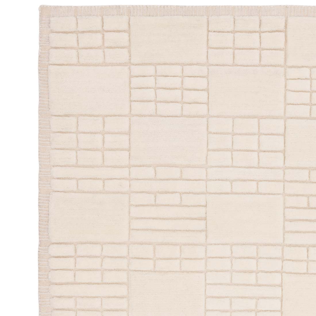 cream wool rug with subtle geometric pattern