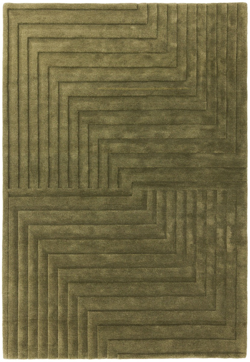 green area rug with a 3d geometric design