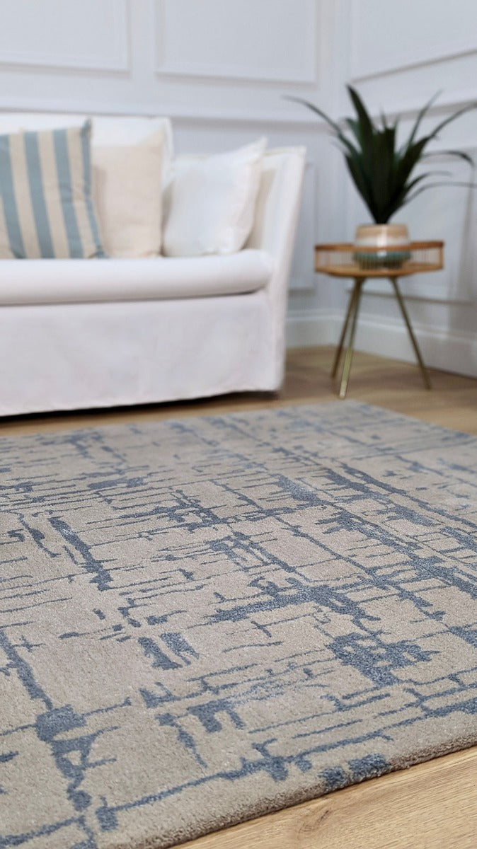 beige wool and viscose rug with blue lines 
