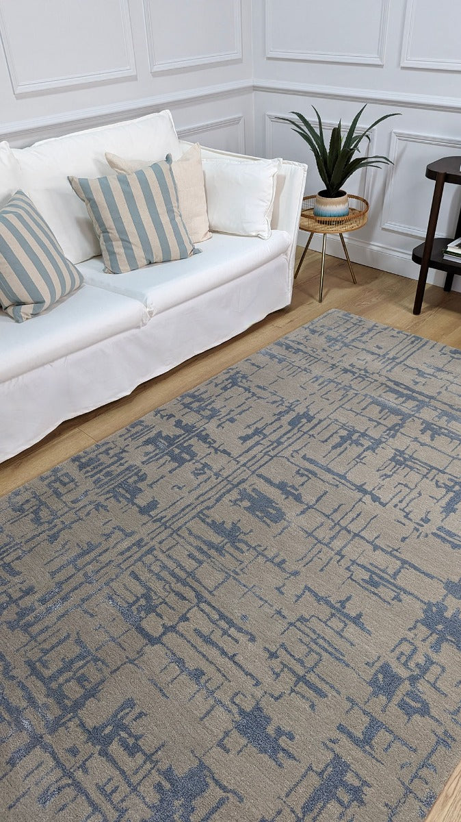 beige wool and viscose rug with blue lines 
