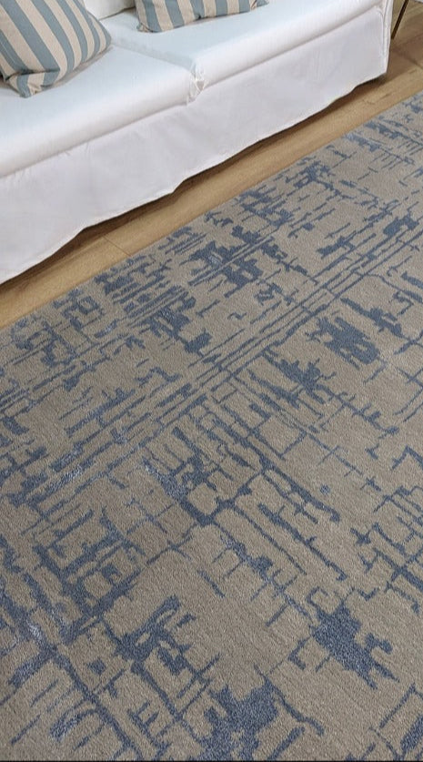 beige wool and viscose rug with blue lines 
