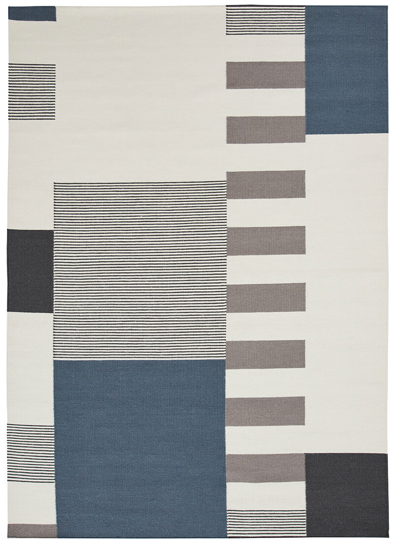 geometric wool rug with blue design
