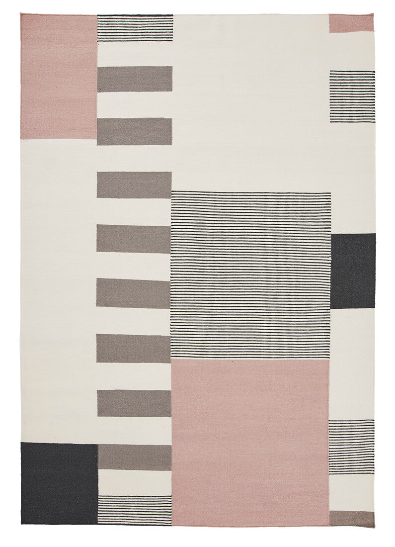 geometric wool rug with pink design
